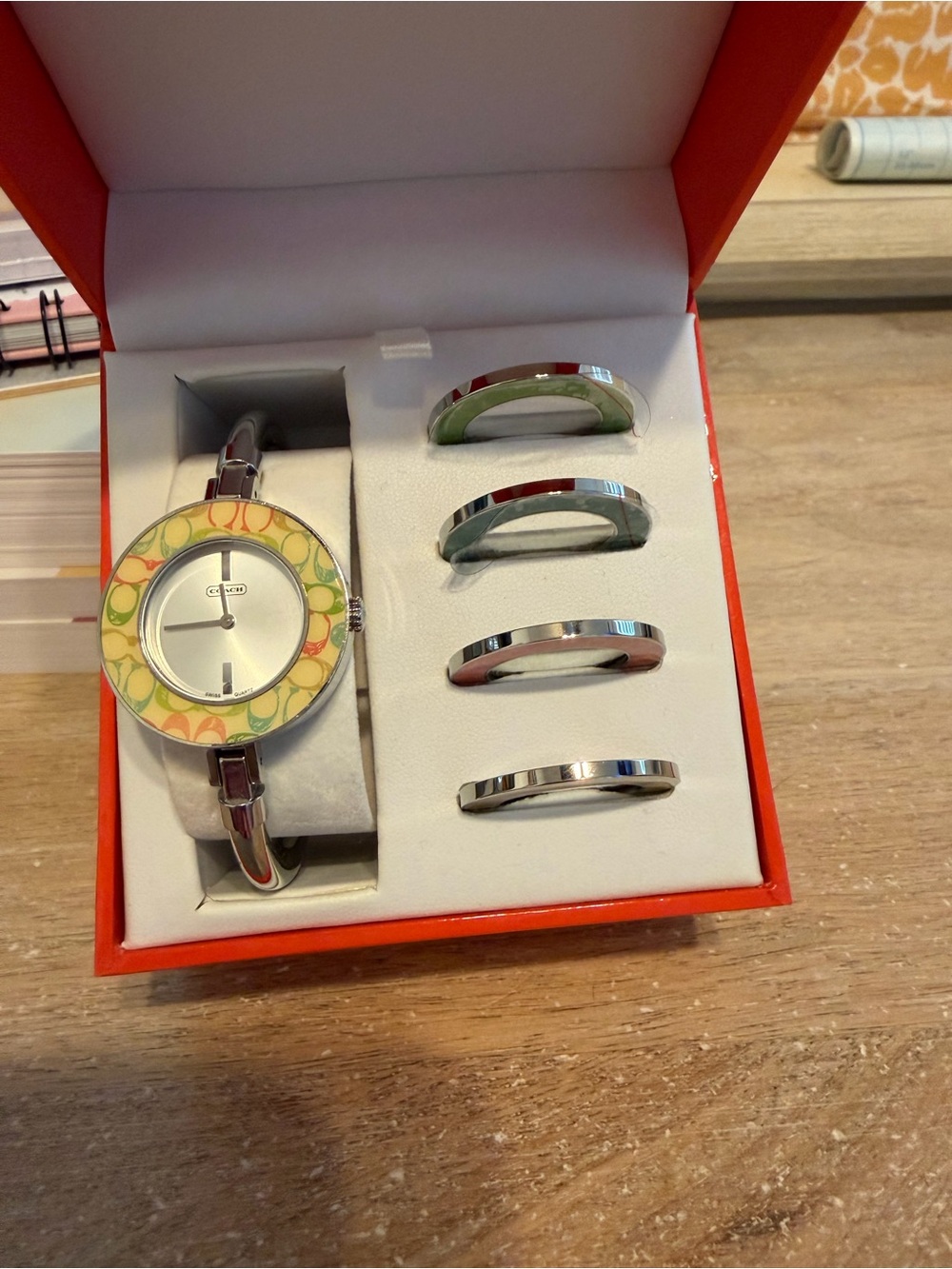 Coach Women's Silver Bangle Watch with Yellow and Green Patterned Bezel